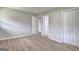 Bedroom with wood floors and open doors leading to hallway at 7279 Mayfair Cir, Jonesboro, GA 30236