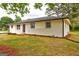 Charming, one-story home featuring a brick facade and complemented by well-maintained landscaping at 7279 Mayfair Cir, Jonesboro, GA 30236