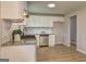 Bright kitchen features stainless steel appliances, granite countertops, and ample cabinet space at 7279 Mayfair Cir, Jonesboro, GA 30236