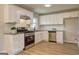 Bright kitchen features stainless steel appliances, granite countertops, and ample cabinet space at 7279 Mayfair Cir, Jonesboro, GA 30236