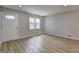Inviting living room showcasing modern floors and natural light at 7279 Mayfair Cir, Jonesboro, GA 30236