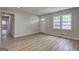 Sun-filled living room featuring modern floors and neutral walls at 7279 Mayfair Cir, Jonesboro, GA 30236
