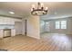 Open-concept living area featuring light filled space and sleek flooring at 7279 Mayfair Cir, Jonesboro, GA 30236