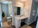 Well-lit bathroom with a marble vanity, a sink, and a toilet at 2691 Old South Dr, Jonesboro, GA 30236
