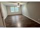 Cozy bedroom featuring hardwood floors, two windows, and neutral paint at 2691 Old South Dr, Jonesboro, GA 30236