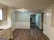 Open-concept dining area with hardwood floors and access to another room at 2691 Old South Dr, Jonesboro, GA 30236