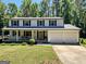Charming two-story home with a welcoming front porch and well-manicured lawn at 2691 Old South Dr, Jonesboro, GA 30236