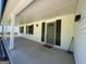 Inviting front porch featuring white columns, black shutters, and an entry door at 2691 Old South Dr, Jonesboro, GA 30236