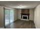 Spacious living room with hardwood floors, a fireplace, and sliding glass doors at 2691 Old South Dr, Jonesboro, GA 30236