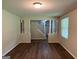 Open living area with hardwood floors, view of the staircase, and natural light at 2691 Old South Dr, Jonesboro, GA 30236