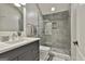 Sleek bathroom with a glass shower enclosure, modern sink, and stylish tile at 400 Conservatory Pt, Fayetteville, GA 30215