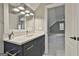 Well-lit bathroom with a modern vanity, fixtures, and a view into the bonus room at 400 Conservatory Pt, Fayetteville, GA 30215