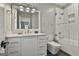 Well-lit bathroom boasting modern fixtures, a glass-enclosed shower, and white vanity at 400 Conservatory Pt, Fayetteville, GA 30215