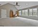 Expansive room featuring vaulted ceiling, a ceiling fan, and lots of natural light at 400 Conservatory Pt, Fayetteville, GA 30215