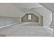 Spacious bonus room with neutral carpet, a ceiling fan, and natural light at 400 Conservatory Pt, Fayetteville, GA 30215
