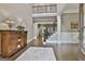 Grand foyer with hardwood floors, staircase with iron railings, and stylish decor for a welcoming entrance at 400 Conservatory Pt, Fayetteville, GA 30215