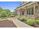 Charming front porch with stone columns and accents offering a welcoming curb appeal at 400 Conservatory Pt, Fayetteville, GA 30215