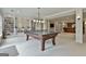 Recreation room with built-in bookshelves, a ping pong table, and recessed lighting at 400 Conservatory Pt, Fayetteville, GA 30215