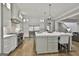 Open kitchen layout includes a large island, stainless steel appliances, and custom cabinets at 400 Conservatory Pt, Fayetteville, GA 30215