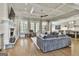 Open-concept living room with coffered ceilings, fireplace, and seamless flow to adjacent spaces at 400 Conservatory Pt, Fayetteville, GA 30215