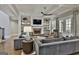 Spacious living room featuring a stone fireplace, built-in shelving, and comfortable seating arrangements at 400 Conservatory Pt, Fayetteville, GA 30215