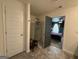 This bathroom features a glass shower and is adjacent to a bedroom with green walls at 142 Hampton Cir, Mcdonough, GA 30253