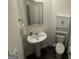 Bathroom featuring a pedestal sink and a toilet with storage at 142 Hampton Cir, Mcdonough, GA 30253