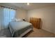 This bedroom offers neutral carpet and walls, and simple decor to add your own touches at 142 Hampton Cir, Mcdonough, GA 30253