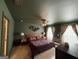 Spacious bedroom featuring a ceiling fan and two bedside tables at 142 Hampton Cir, Mcdonough, GA 30253