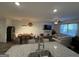Open concept dining and living areas featuring hardwood floors and recessed lighting at 142 Hampton Cir, Mcdonough, GA 30253