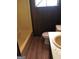 Bathroom featuring a yellow tub, toilet, sink and vinyl wood flooring at 6186 Green Acres Sw Dr, Covington, GA 30014
