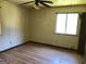 Empty bedroom with new wood floors, neutral walls, and a ceiling fan light fixture at 6186 Green Acres Sw Dr, Covington, GA 30014