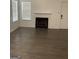 Bright living room featuring a fireplace, laminate flooring, and plenty of natural light at 1047 Plantation Nw Way, Kennesaw, GA 30144
