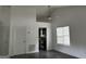 Living room featuring a view into the kitchen and a ceiling fan at 1047 Plantation Nw Way, Kennesaw, GA 30144