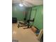 Multi-purpose basement area set up with gym equipment and space for storage or recreation at 30 Wellington Trl, Covington, GA 30016