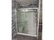Bathroom shower with glass doors and sleek fixtures, showcasing modern design at 30 Wellington Trl, Covington, GA 30016