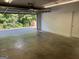 Spacious two-car garage featuring a clean concrete floor and plenty of room for storage at 30 Wellington Trl, Covington, GA 30016