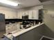 Well-organized kitchen with light-colored cabinets, stainless steel appliances, and modern fixtures at 30 Wellington Trl, Covington, GA 30016