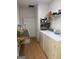 Functional laundry room with washer, dryer, and storage shelves to keep things organized and tidy at 30 Wellington Trl, Covington, GA 30016