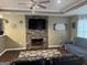 Inviting living room with a decorative stone fireplace, flat screen television, and comfortable seating at 30 Wellington Trl, Covington, GA 30016