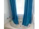 Bathroom with a bathtub and a blue curtain at 625 Locust Rd, Locust Grove, GA 30248