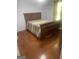Cozy bedroom with hardwood flooring and a comfortable queen-sized bed perfect for relaxation at 625 Locust Rd, Locust Grove, GA 30248