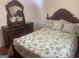 Bedroom with hardwood floors, bed, and a wooden dresser at 625 Locust Rd, Locust Grove, GA 30248