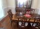 Elegant dining room with a classic wooden table and ornate chairs at 625 Locust Rd, Locust Grove, GA 30248