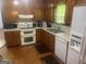 Functional kitchen featuring wood cabinetry and standard appliances at 625 Locust Rd, Locust Grove, GA 30248