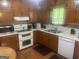 Functional kitchen with wood cabinetry and essential appliances at 625 Locust Rd, Locust Grove, GA 30248