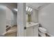 Bright bathroom with modern sink and toilet, complemented by neutral paint at 11616 Spring Lake Way, Fayetteville, GA 30215