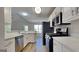 Modern kitchen featuring quartz countertops, stainless steel appliances, and ample cabinet space at 11616 Spring Lake Way, Fayetteville, GA 30215