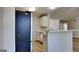 Modern kitchen with white cabinets, stainless steel appliances, and a breakfast bar at 11616 Spring Lake Way, Fayetteville, GA 30215