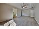 Large carpeted main bedroom with ceiling fan and doors to a bathroom and closet at 11616 Spring Lake Way, Fayetteville, GA 30215